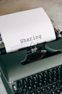 A typewriter writing sharing symbolising sharing information