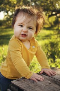 A curious toddler playing the garden