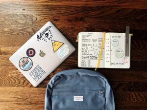 A school child's backpack, laptop and notepad