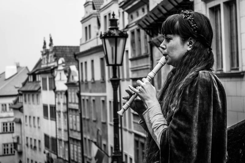 A lady playing the Recorder in the street