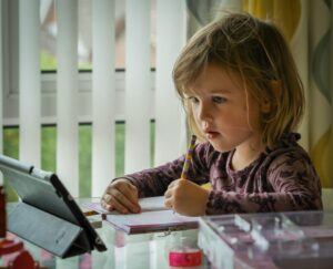 A child learning through an app on an iPad