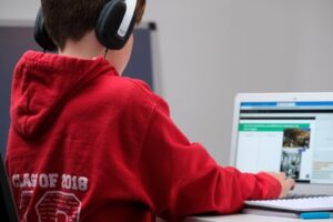 A child learning digitally through his laptop