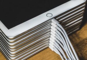 A stack of charging iPads