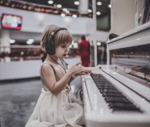 A young child playing the piano