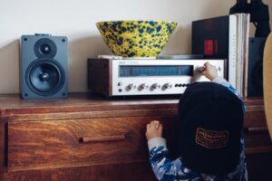 A child playing with the stereo