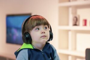 A kid listening to his favourite music for homework