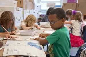 Third grade kids learning to read in school