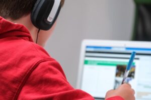 A child learning remotely with a laptop