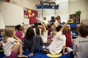 A children's classroom reading a story together