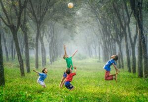 Children playing in a forest