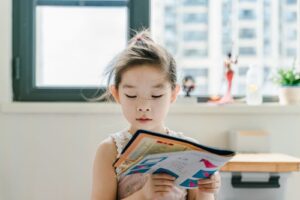 Children developing listening and comprehension skills while reading