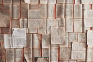 A series of open books on the floor