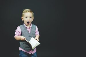 A child holding an open book