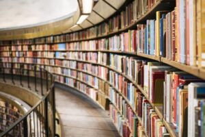 A long and full bookcase in a library