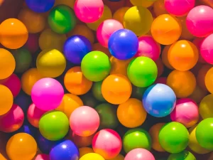 Kids learning through play in a ball pit