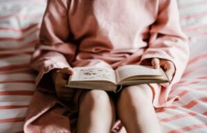 A child holding an open book