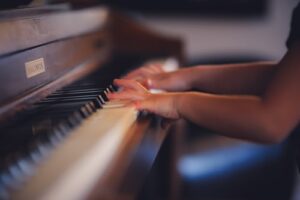 A child learning to play the piano