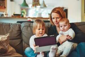 A mother and two children learning through EdTech