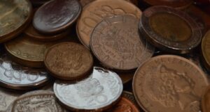 A close-up of lots of different kinds of coins