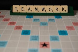 Teamwork shown on a scrabble board