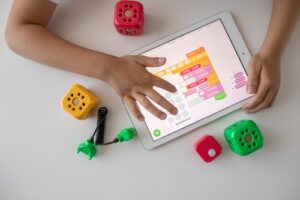 A child playing Edtech on a tablet device