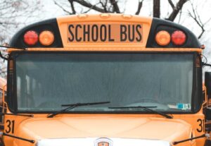 The front of an American orange school bus