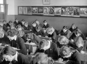 A classroom full of children in black and white